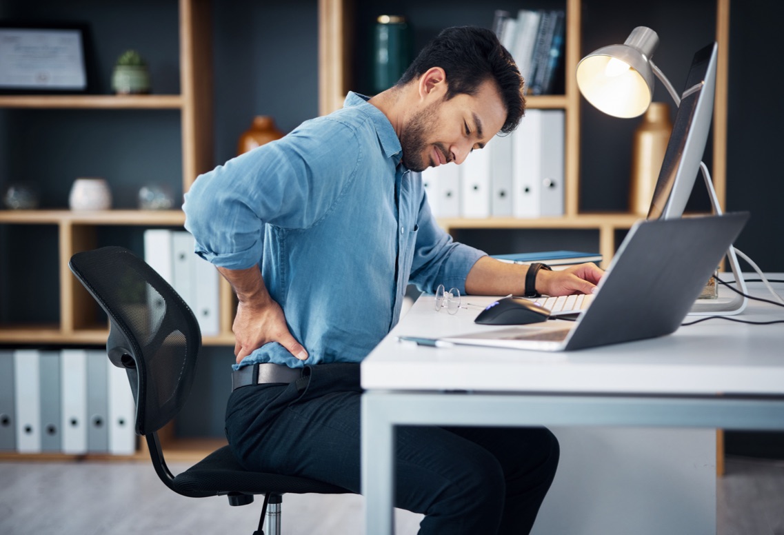 Man at desk with back pain