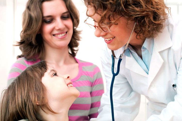 Doctor with child and mom