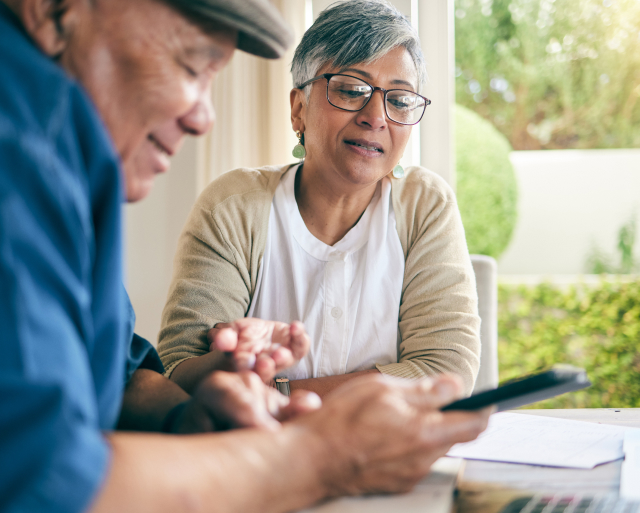 Senior couple looking at paperwork