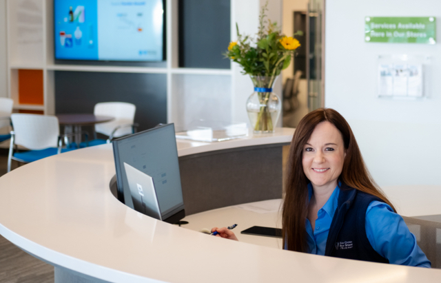 Your Blue Store associate behind counter